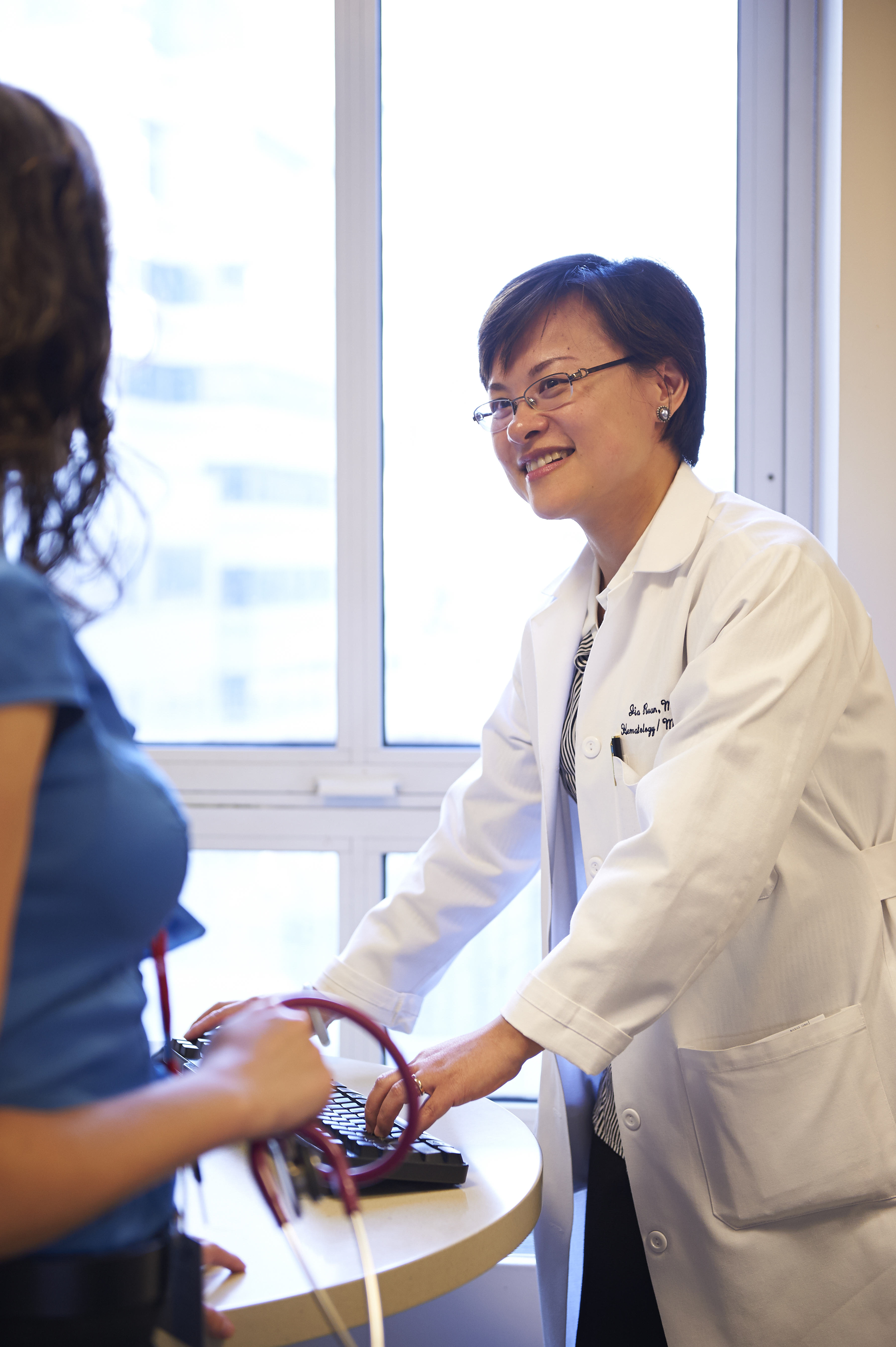 Dr. Ruan at computer